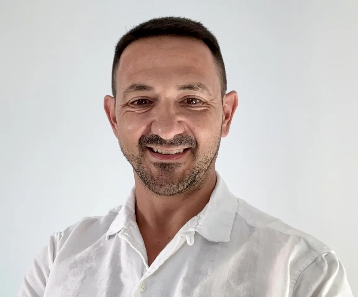 Carlos Cámara is a caucasian with black hair